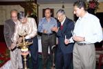 K C Thyagaraj lighting the lamp of hope and Prosperity. Family members K C Venugopal, K C RaviShanker, K. S. Malle Gowda are applauding the event.